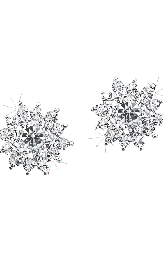 Pair of snowflake-shaped silver earrings with clear gemstones on a purple background