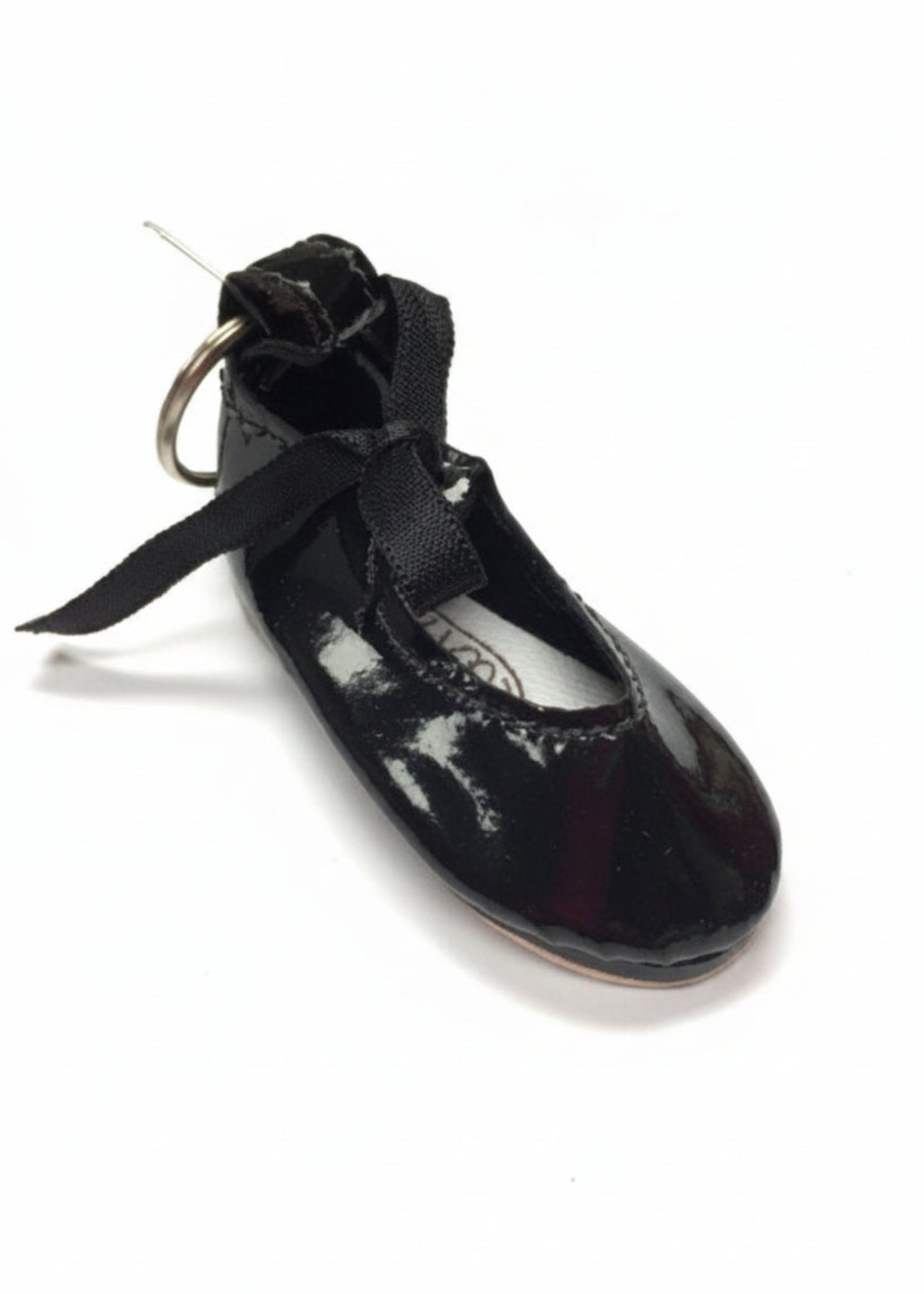 Mini tap shoe keychain with detailed design and miniature taps