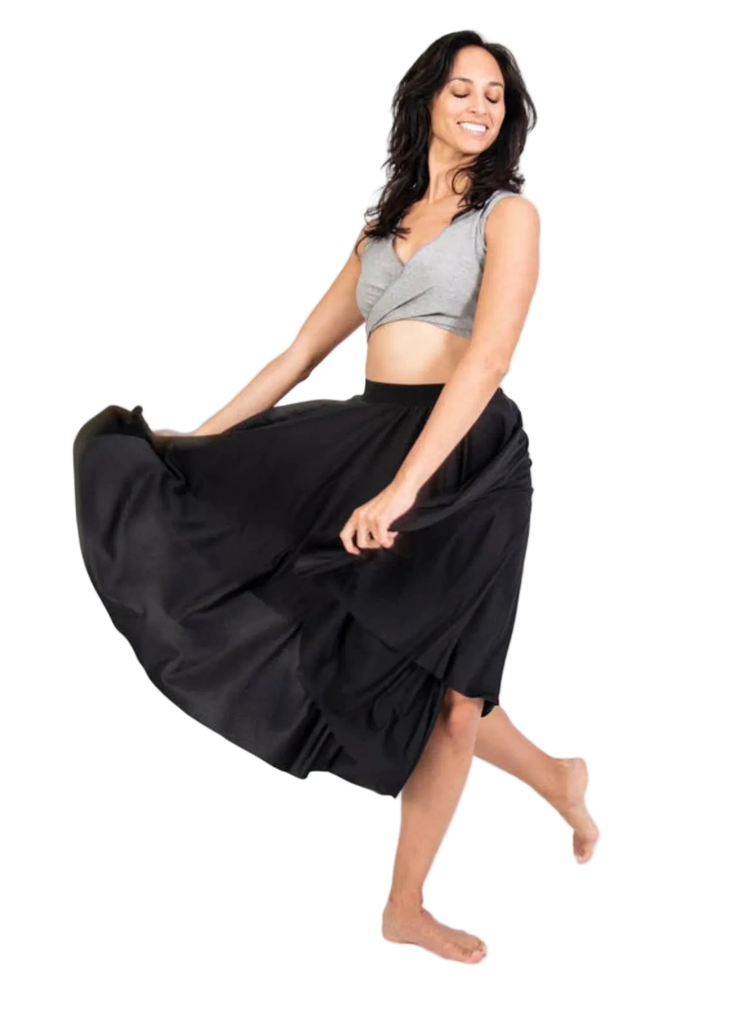 Bodywrappers 24" Circle Skirt in Black, lifestyle view showing matte polyester fabric spread into a wide flare