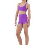 Every Turn All-Sports Short in Power Purple, lifestyle view showing high-waist short with lavender contrast panel and trim