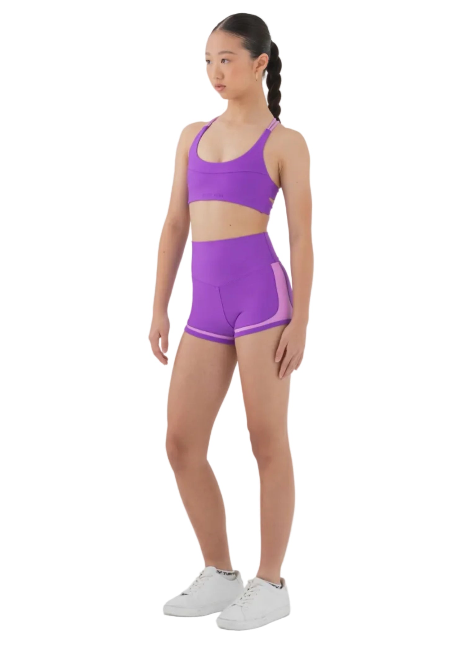 Every Turn All-Sports Short in Power Purple, lifestyle view showing high-waist short with lavender contrast panel and trim