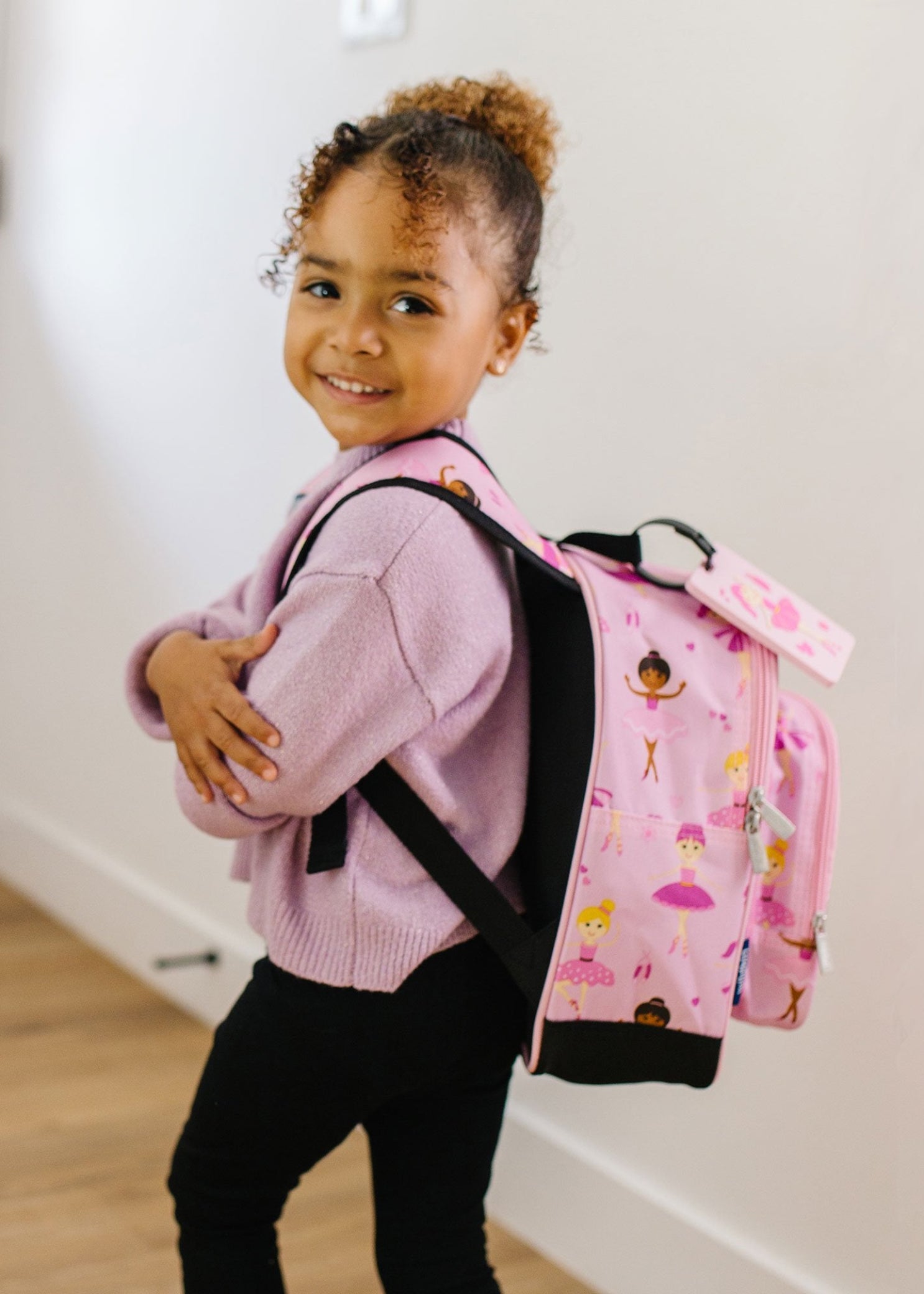 Wildkin Polyester Ballerina Snack Backpack in Pink, lifestyle view showing ballerina print and padded straps