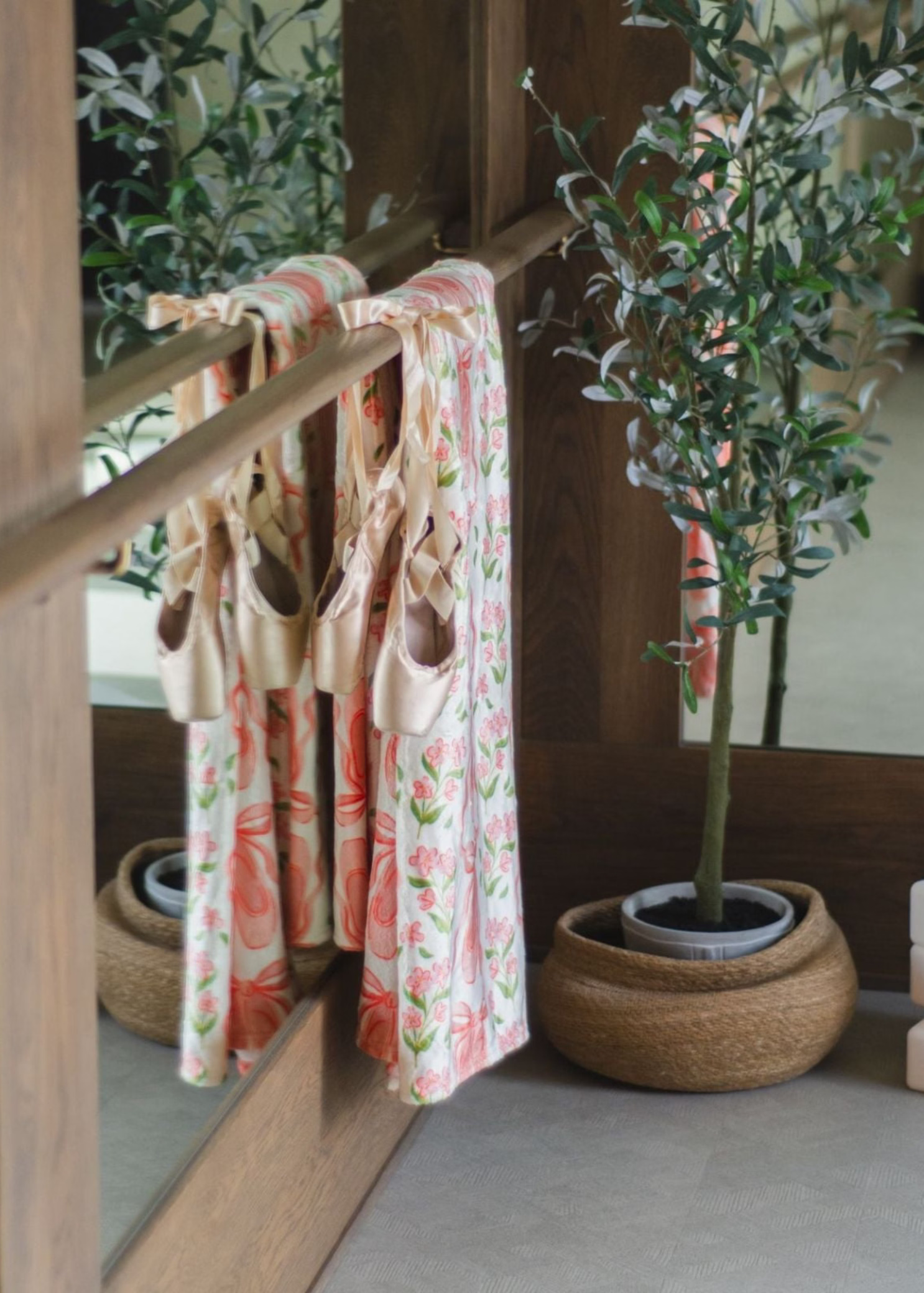 Pippi Post Ballet Fleece Throw Blanket in Pink Ballet Slippers & Florals, lifestyle view showing draped fleece print