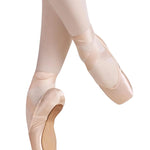RP Collection Baroque Pointe Shoe Medium Shank in Pink, lifestyle view showing outsole and satin upper with tapered box