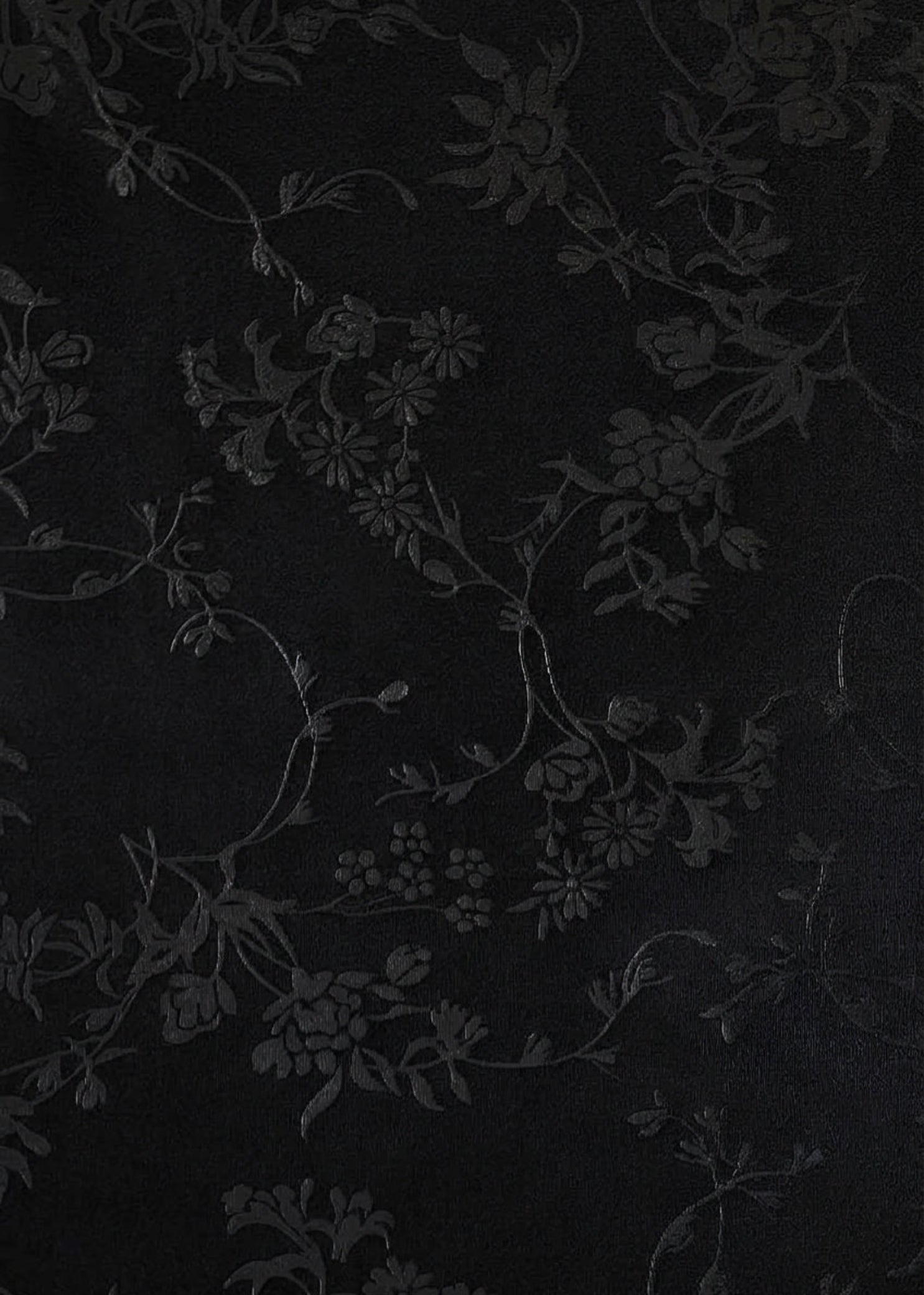Bloch Veronica Halter Leotard in Black, fabric detail view showing tonal floral pattern with subtle shine