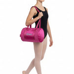 Horizon Designs Coco Duffel in Pink, lifestyle view showing diamond quilt texture and sequin dance lettering
