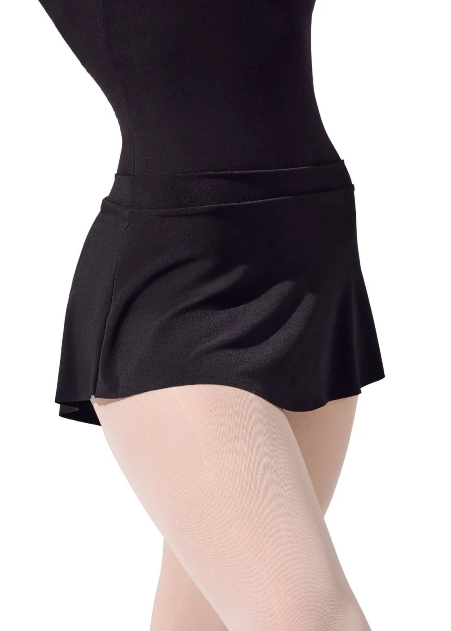 Capezio Curved Pull On Skirt in Black, side view showing polyester fabric, side seam and curved hem