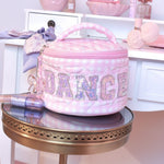 OMG Accessories Dance Gingham Round Glam Bag in Pink, lifestyle view showing gingham exterior and glitter DANCE lettering