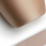 Capezio Elastic For Pointe Shoes, lifestyle view showing ribbed elastic strip beside pointe shoe toe box
