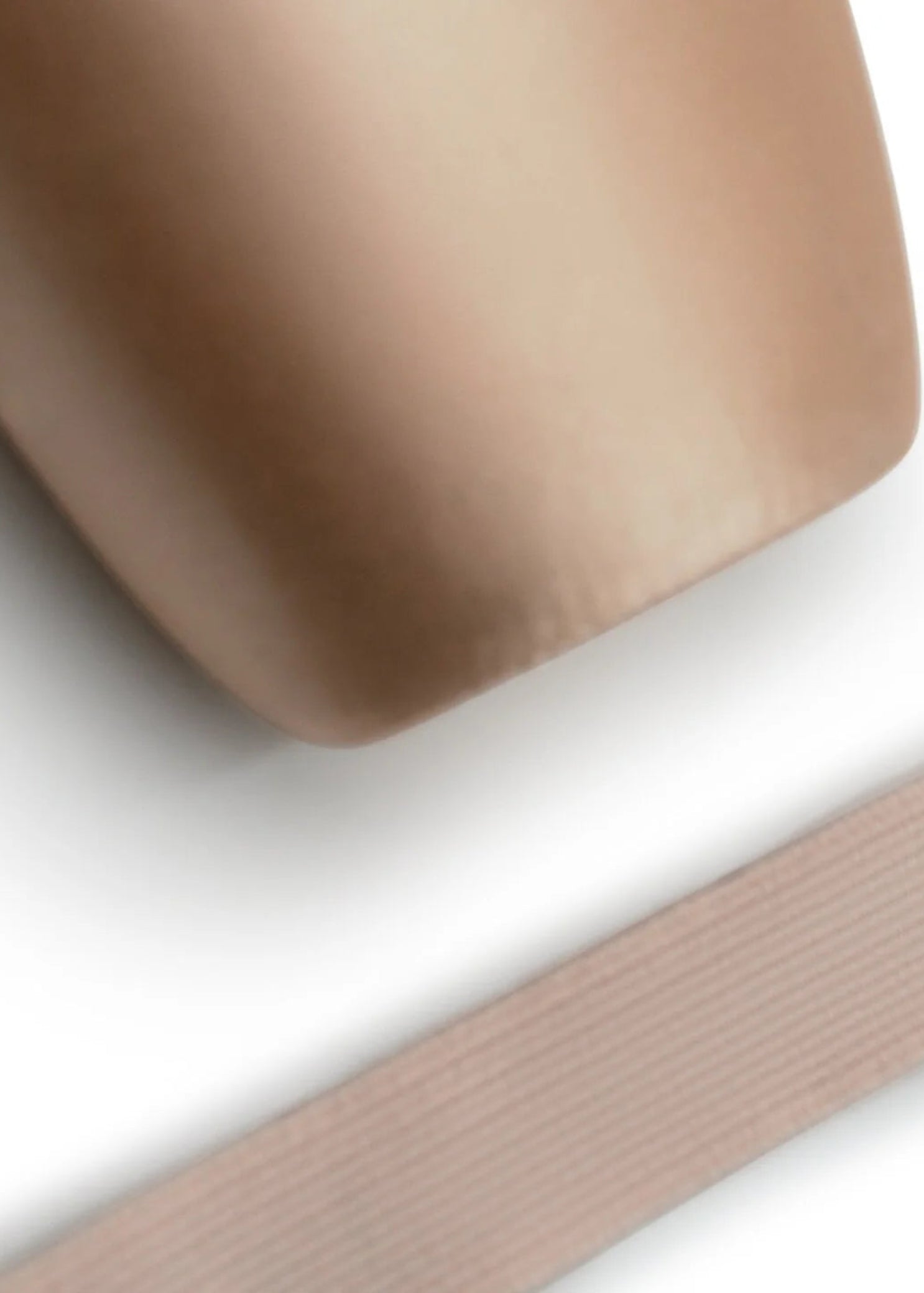 Capezio Elastic For Pointe Shoes, lifestyle view showing ribbed elastic strip beside pointe shoe toe box