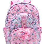 OMG Accessories Polyester/PVC Floral Quilted Large Backpack in Pink, front view showing floral print and bow charm