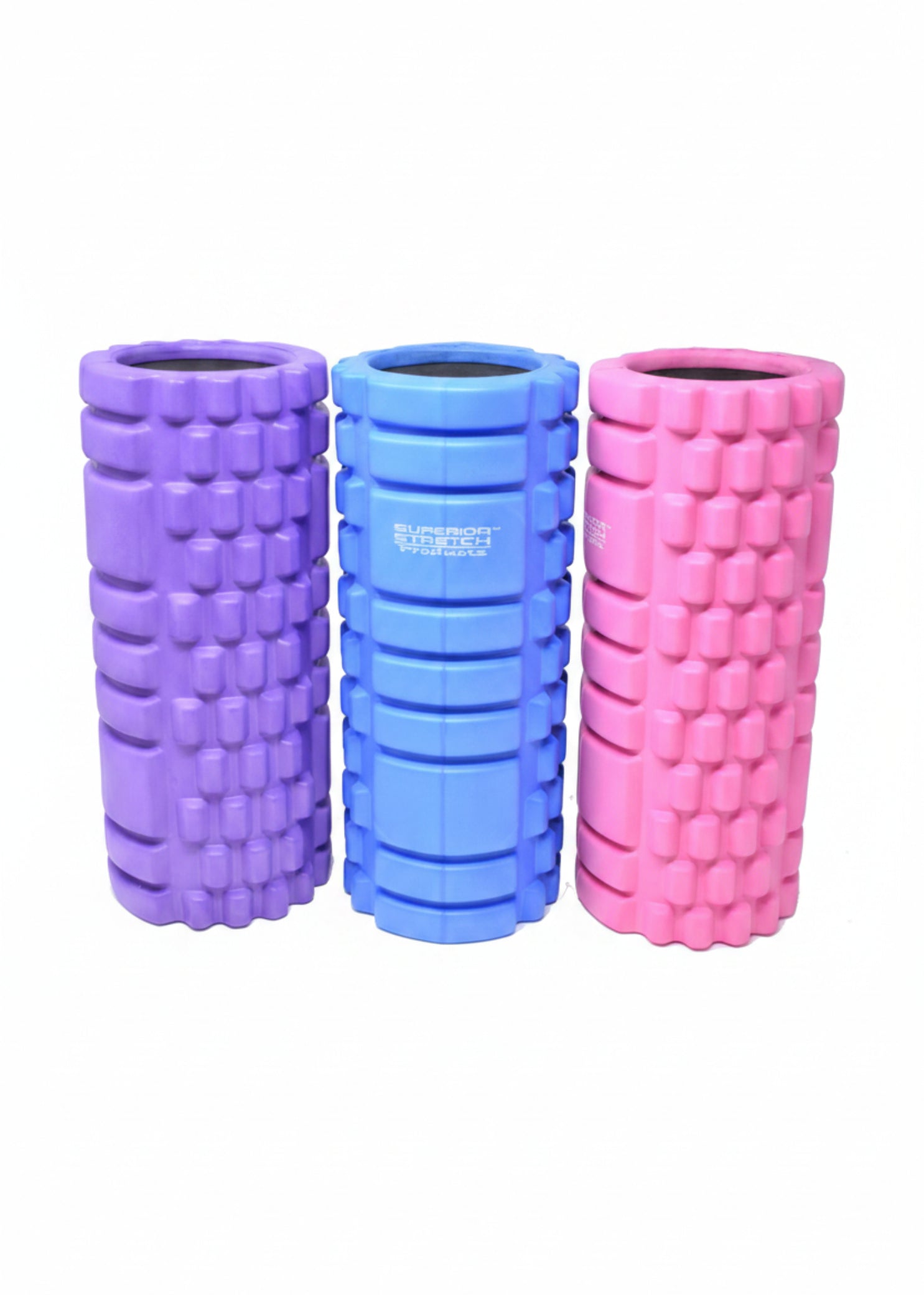 Superior Stretch foam fitness roller, collection view showing all three colors — Purple, Blue, and Pink — with dual-zone grid texture and solid-core hollow-center construction on white background