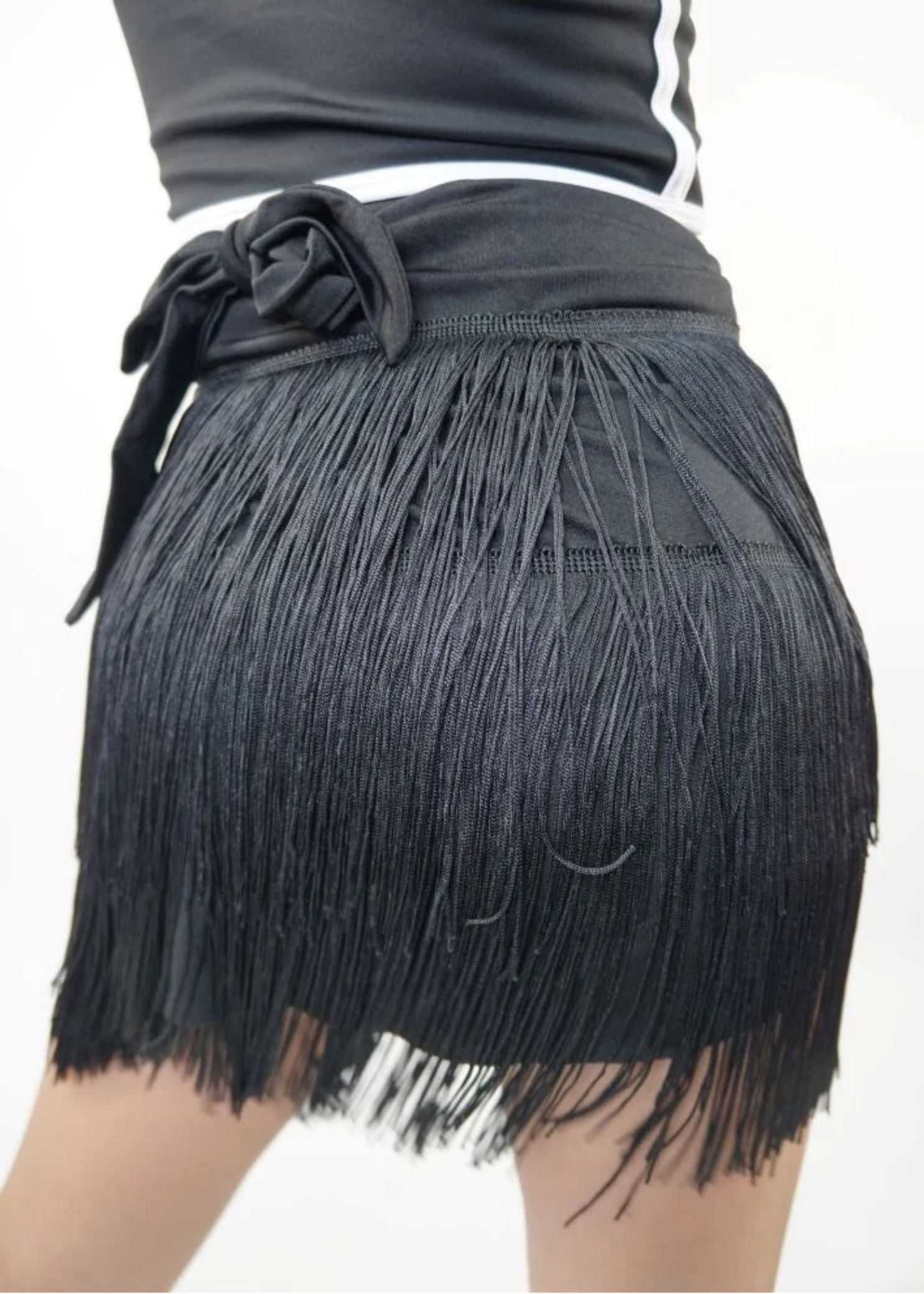 Trendy Trends Fringe Ballroom Skort in Black, back view showing layered fringe and tied waistband bow