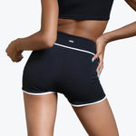 Tiger Friday Horizon Shorty in 8 Ball, back view showing contrast piping and fitted shortie silhouette