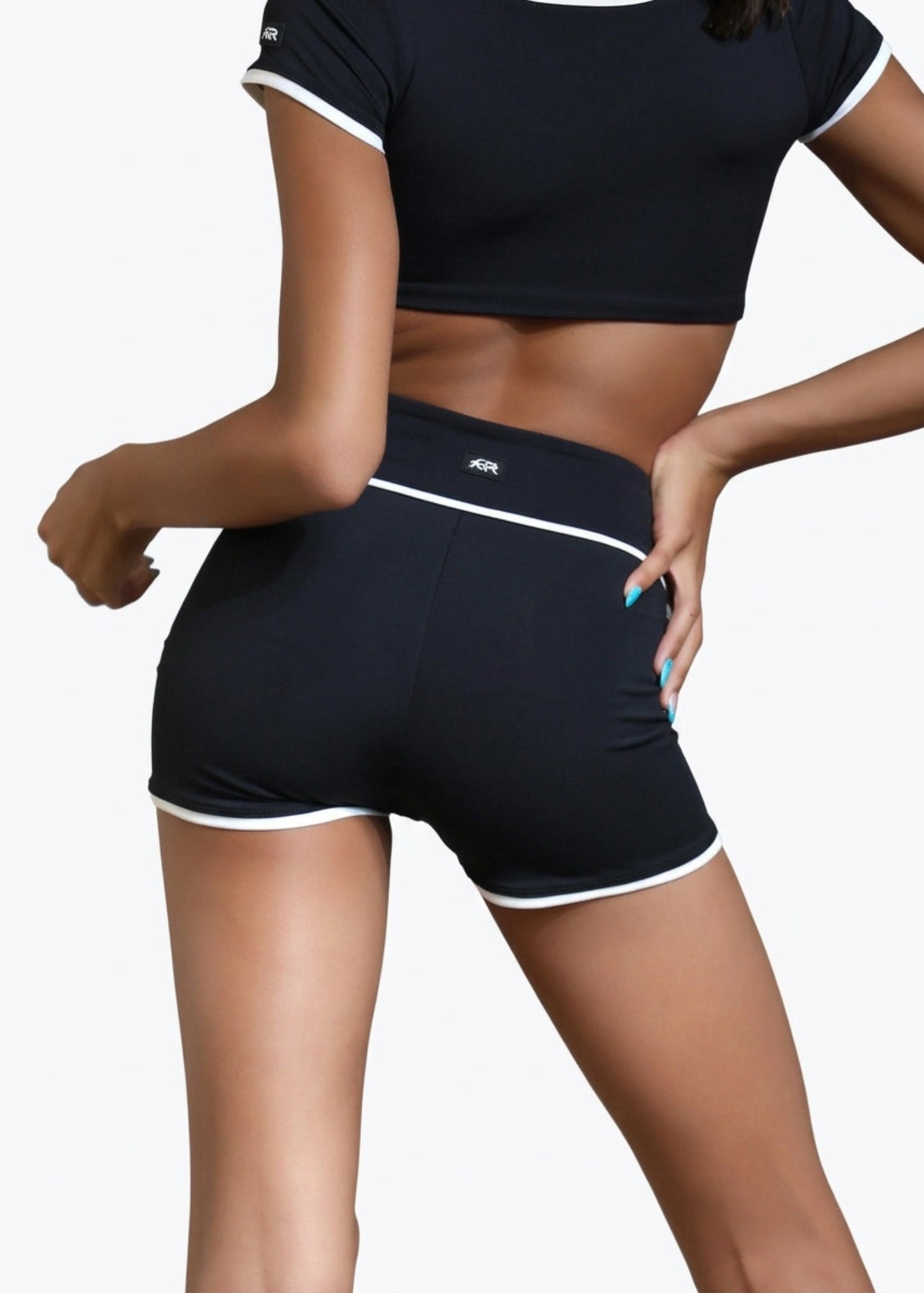 Tiger Friday Horizon Shorty in 8 Ball, back view showing contrast piping and fitted shortie silhouette