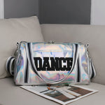 Dasha Designs Iridescent Pro Duffel in Pink and Lavender, lifestyle view showing iridescent exterior and bold DANCE lettering
