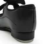 Capezio Jr. Tyette Tap Shoe in Patent Black, back view showing patent PVC upper and heel construction