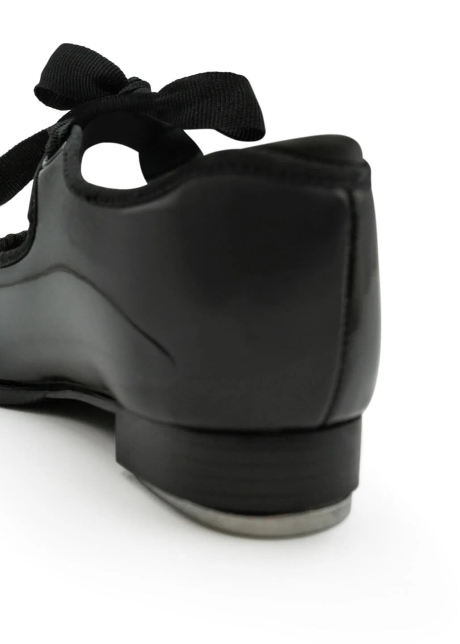 Capezio Jr. Tyette Tap Shoe in Patent Black, back view showing patent PVC upper and heel construction
