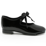 Capezio Jr. Tyette Tap Shoe in Patent Black, lateral side view showing patent PVC upper and grosgrain ribbon tie