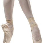 R Class Legata Pointe Shoe Vamp 3 in Pink, lifestyle view showing vamp and elastic straps with ribbon wrap en pointe
