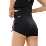 Tiger Friday Leggy Shocks in Black, angled back view showing footless dance tights with stirrup detail