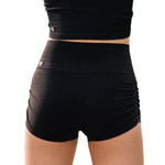Tiger Friday Leggy Shocks in Black, back view showing footless dance tights with stirrup detail