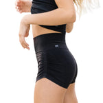 Tiger Friday Leggy Shocks in Black, side view showing footless dance tights with stirrup detail