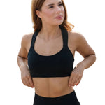 Tiger Friday Let It Slide Crop in Black, front view showing cropped dance top with off-shoulder neckline