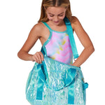 Capezio Metallic Star Duffle in Metallic Turquoise, lifestyle view showing waterproof exterior and shoulder strap