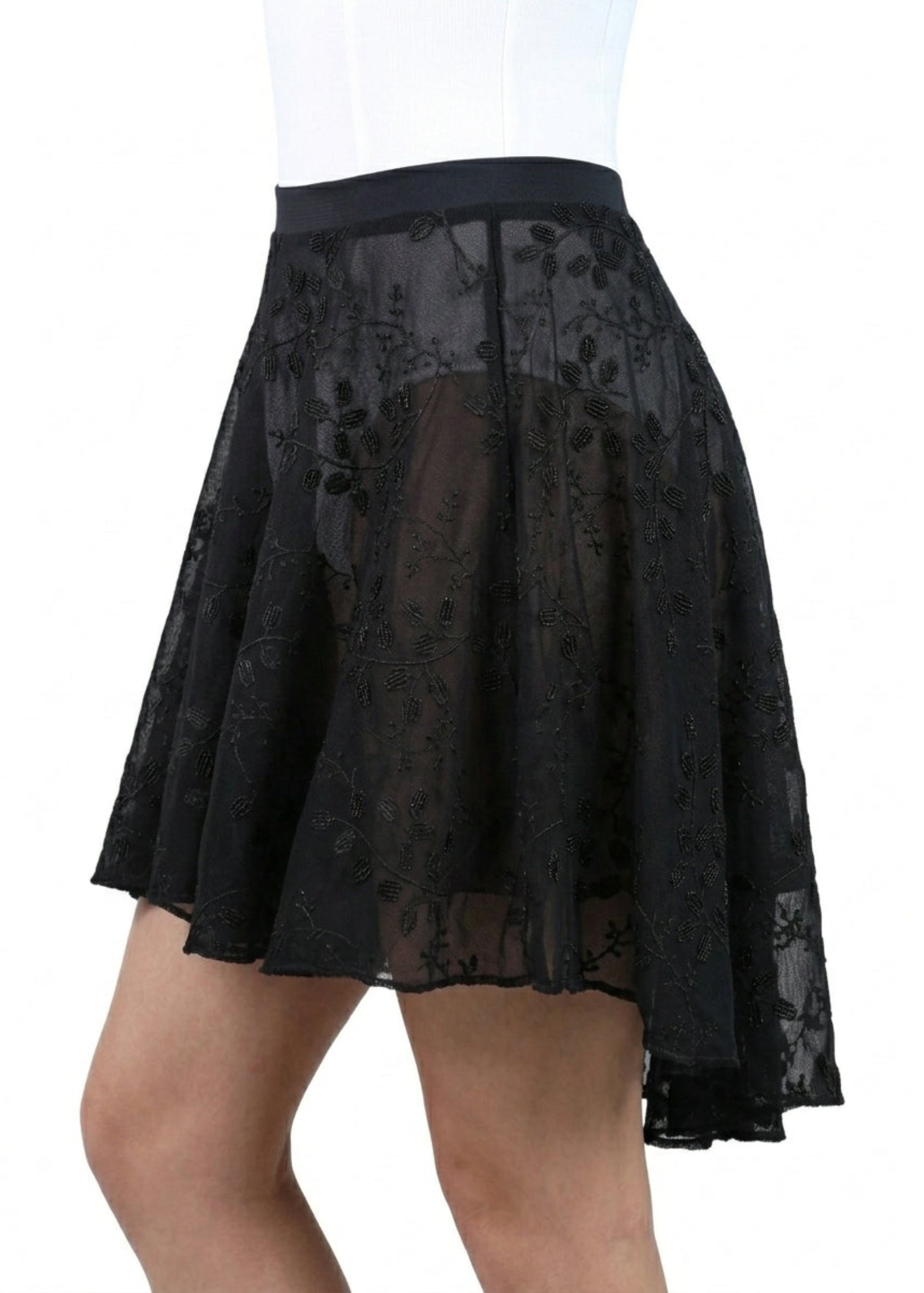 Suffolk Midi Length Skirt in Black, side view showing floral nylon-spandex mesh and flowing high-low hem