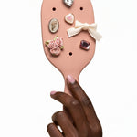 Kitsch Paddle Brush in Terracotta, back detail view showing cushioned base and pin bristle pattern