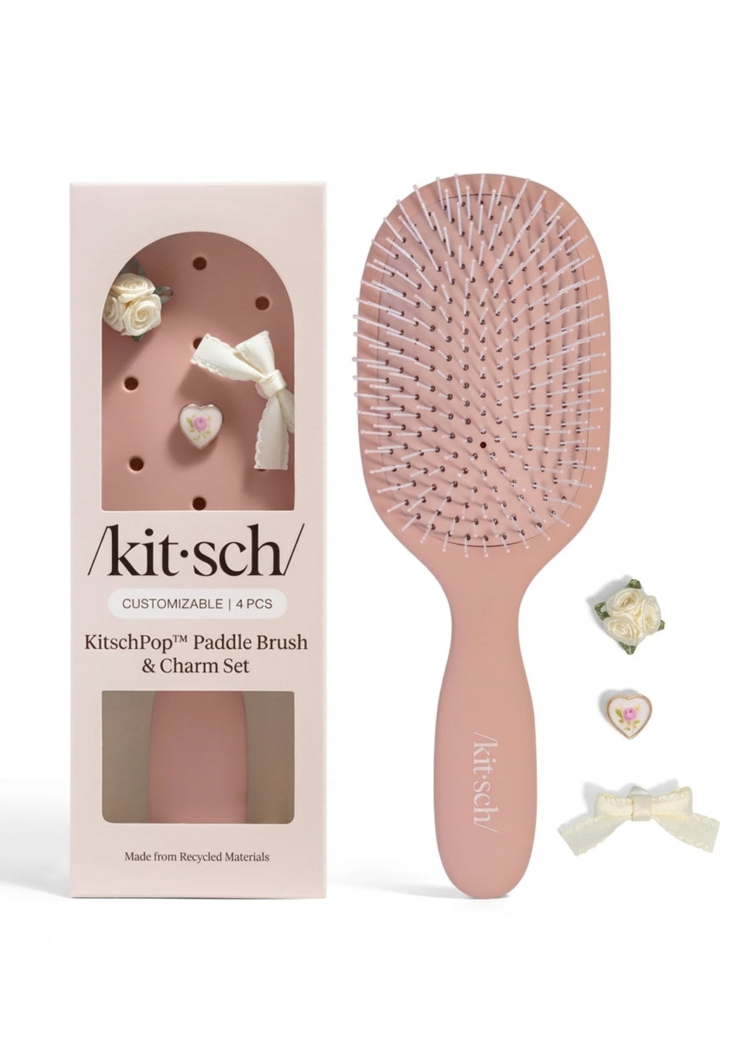 Kitsch Paddle Brush in Terracotta, front view showing terracotta handle and cushioned bristle base