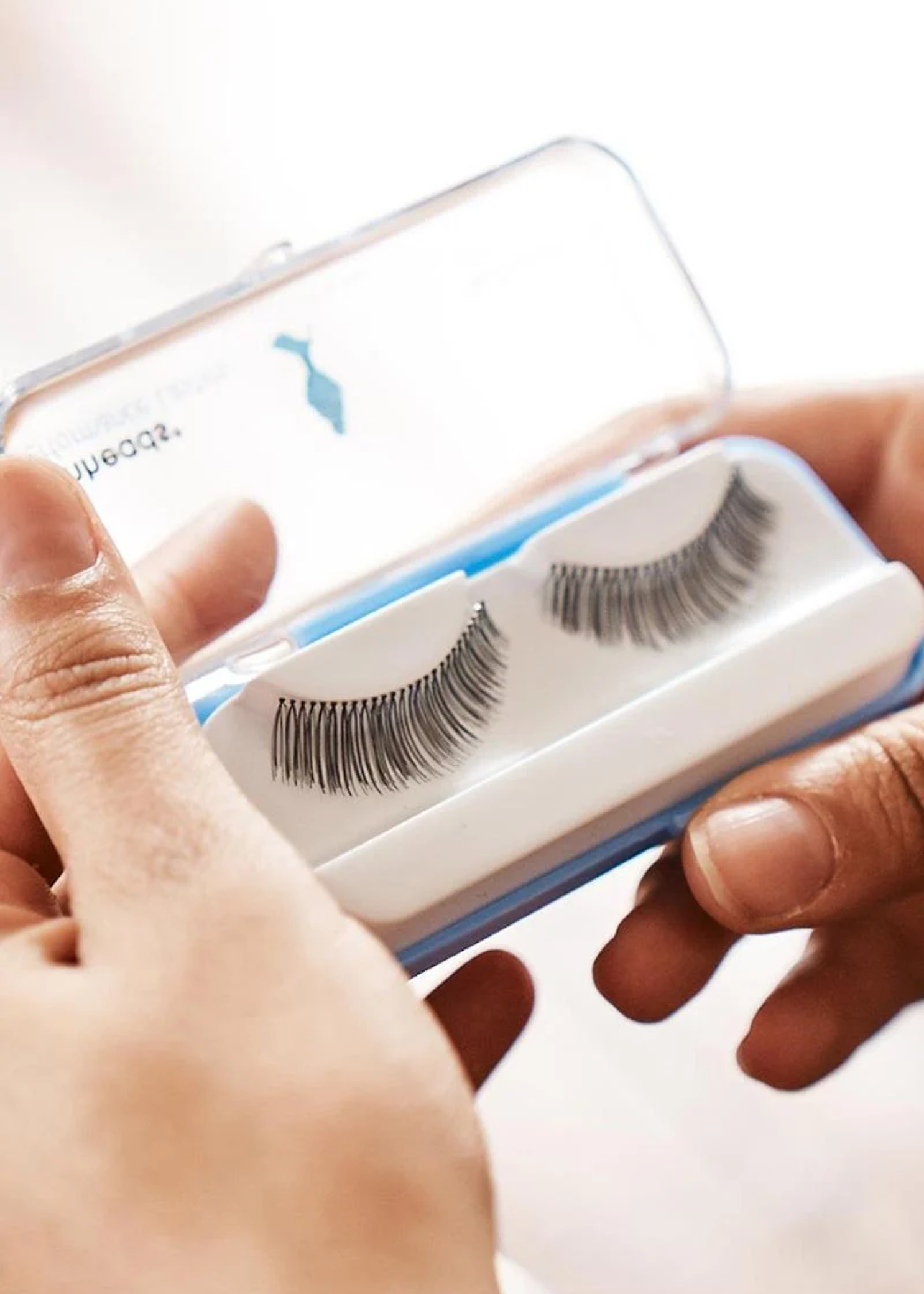 Capezio Performance Eyelashes, front view with lid open showing lash pair on a white curved tray
