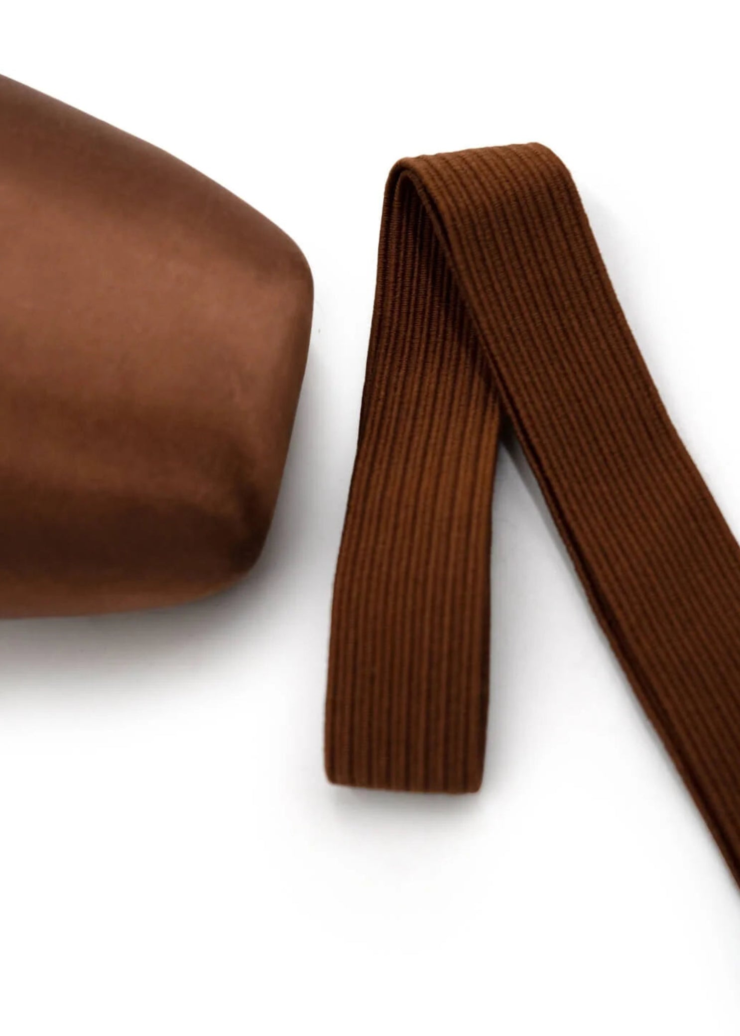 Capezio Pointe Shoe Elastic in Skintone 55, lifestyle view showing ribbed band beside pointe shoe