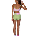 XO Dance Company Polka Dot Top in Strawberry Matcha, back view showing adjustable straps and dots
