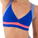 Every Turn Revolve Crop Top in Cobalt, closeup front view showing twisted neckline and color blocking