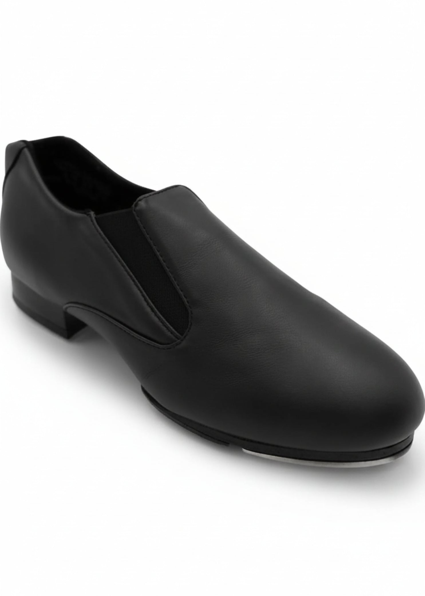 Capezio Riff Slip-On Tap Shoe in Black, angled lateral side view showing slip-on construction and tap shoe profile