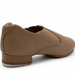 Capezio Riff Slip-On Tap Shoe in Caramel, angled back view showing heel construction and slip-on design