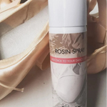 Bloch Rosin Spray, detail view showing labeled 100ml aerosol can with white cap beside pointe shoes