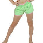 Young girl wearing a pink and green crop top with matching shorts on a white background