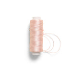 RP Collection Sewing Thread in Pink, front view showing wound thread and loose loops