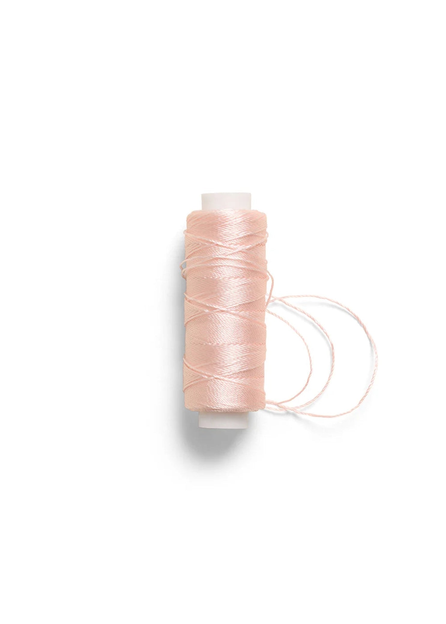 RP Collection Sewing Thread in Pink, front view showing wound thread and loose loops