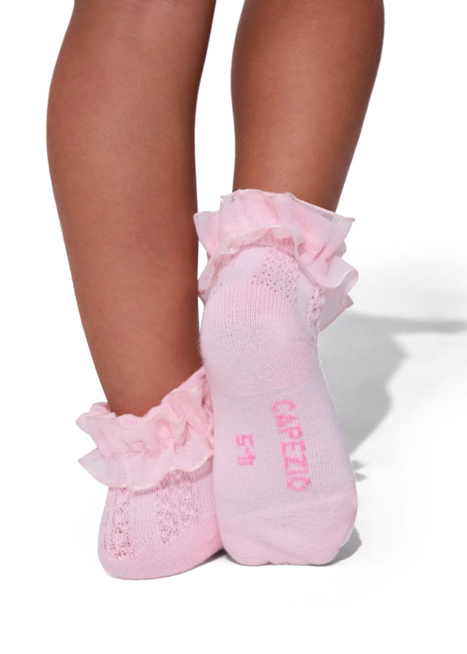 Capezio 3-Pack Ruffle Sock in Pink, lifestyle view showing ruffled ankle trim and pointelle knit detail