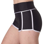 Capezio Skayla Short in Black & White, side view showing nylon-spandex fabric, high-rise waist and contrast piping