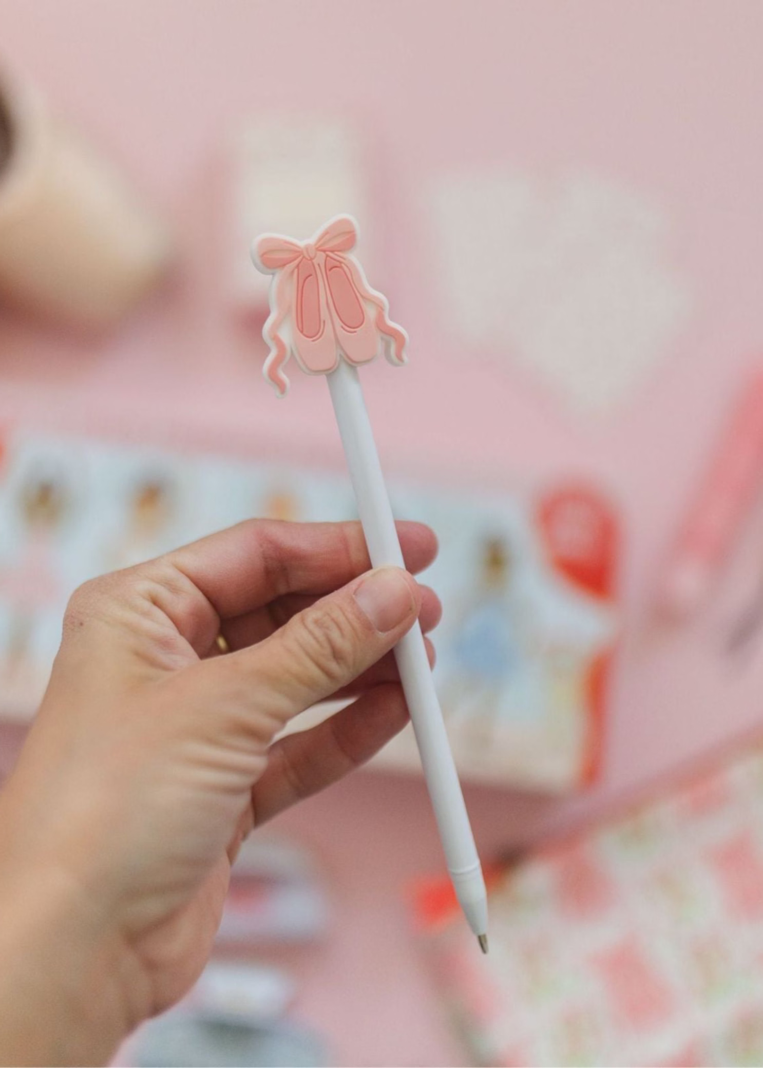 Pippi Post Slippers & Bow Gel Pen, lifestyle view showing ballet slipper and bow topper with exposed writing tip