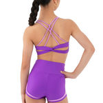 Every Turn Socialite Crop Top in Power Purple, back view showing dual crossed straps and twisted back panel