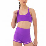Every Turn Socialite Crop Top in Power Purple, front view showing scoop neck and polyester-elastane fabric