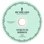 Capezio Stretch Ribbon Bolt in Light Pro Pink, top view showing circular spool label and center opening