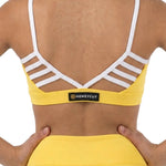Honeycut Treat Top in Sunshine, back detail view showing white ladder straps, V-shaped trim and logo patch