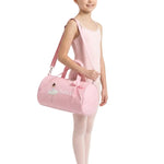 Dasha Designs Twinkle Toes Duffel in Pink, lifestyle view showing ballerina graphic and DANCE lettering